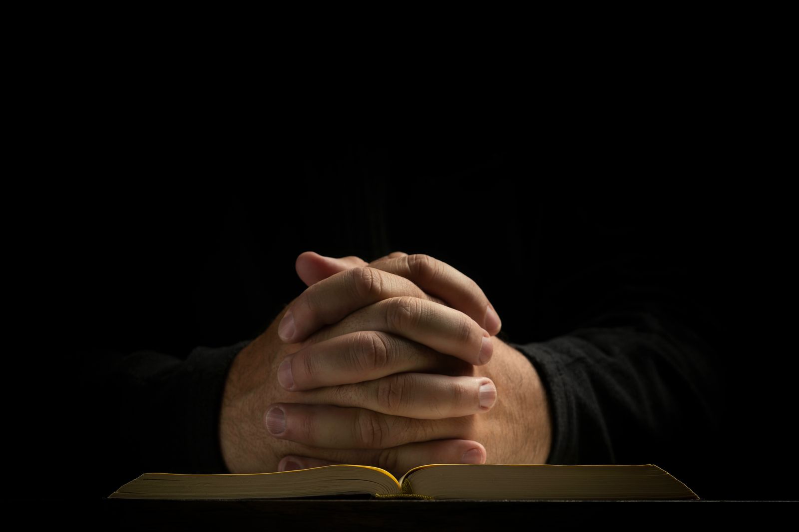 Open Bible and journal with handwritten Scripture notes in calm morning light